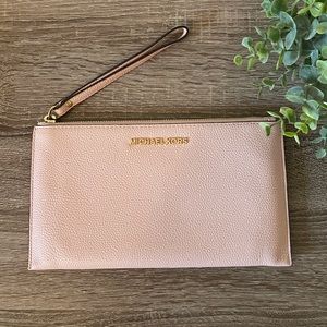 Michael Kors light pink wristlet wallet